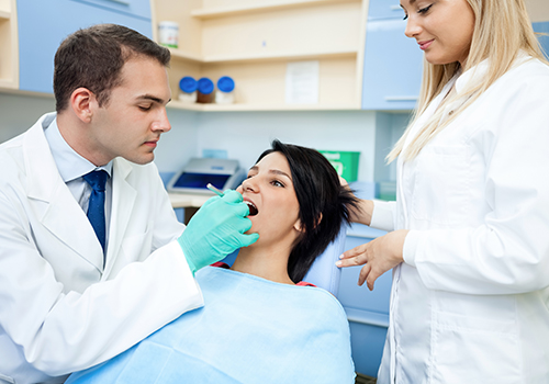 Dentist performing procedure on patient