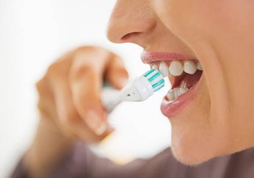Close-up of woman brushing teeth